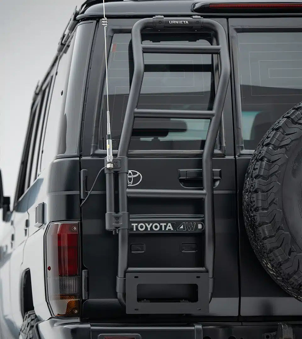Back of a Toyota vehicle with a ladder rack on a cloudy day