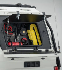 Trunk of a vehicle with tools and equipment organized inside