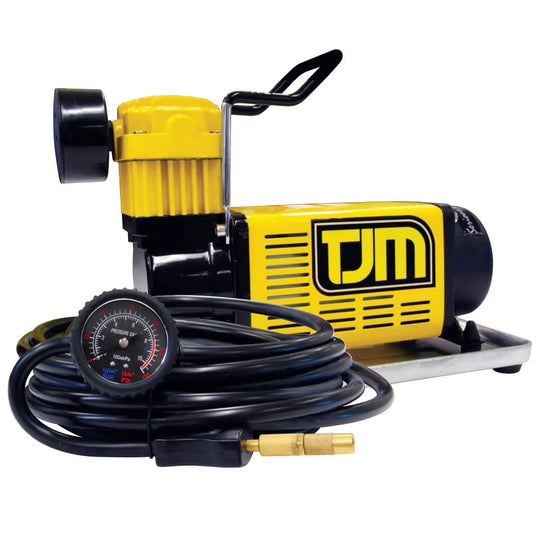Yellow and black air compressor with hose and gauge on a white background