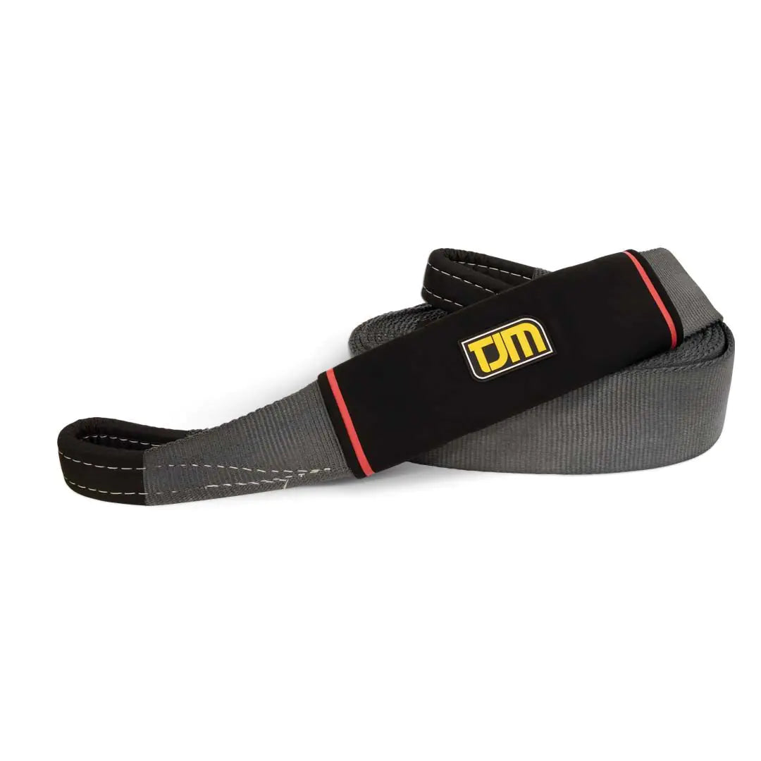 Black and gray resistance band with a logo on a white background